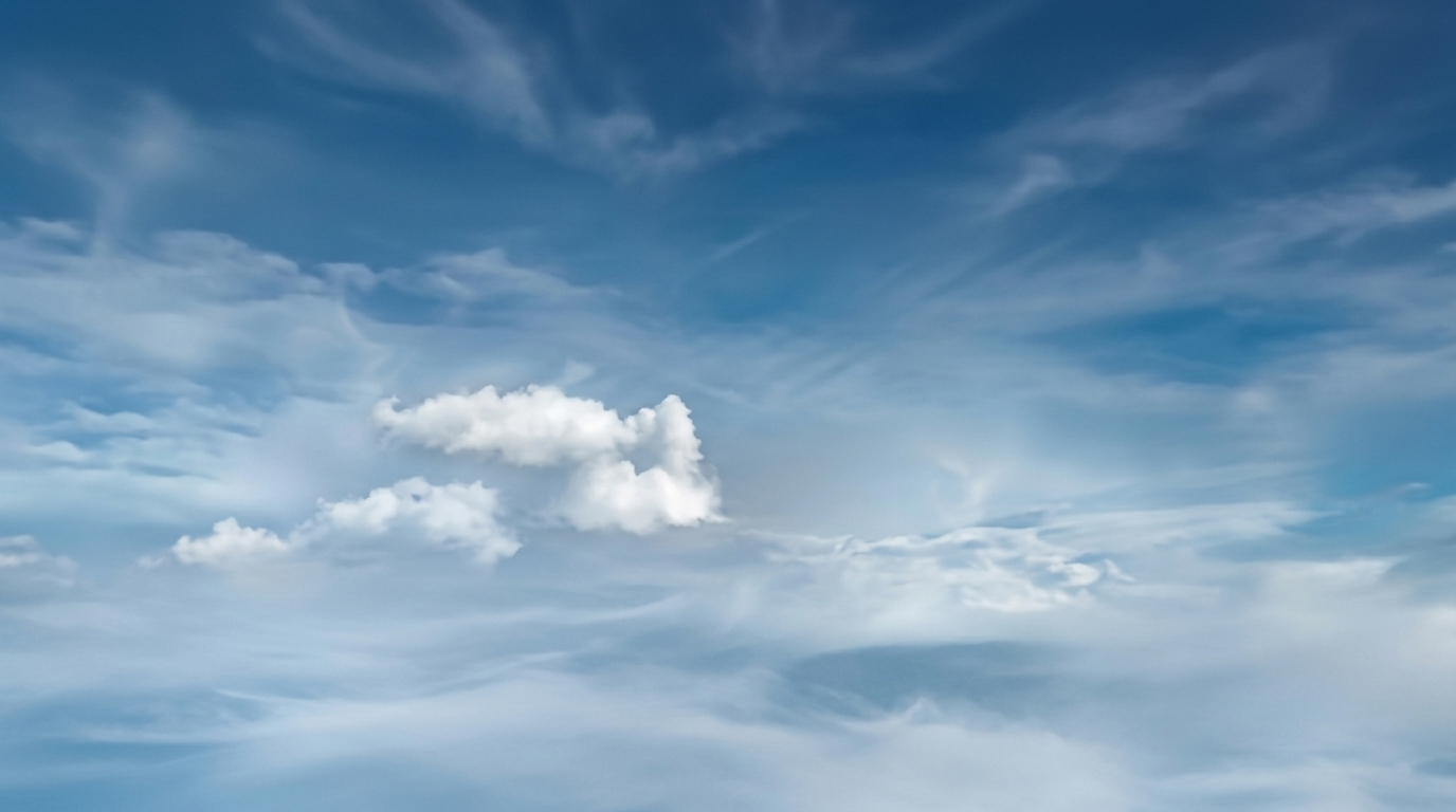 A whitewashed Cycladic stair descending toward the Aegean sea, late afternoon light raking across the stone.